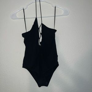 Black body suit with zig zag cut out